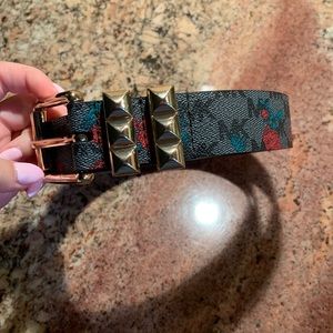 Michael Kors size small belt. Black and grey with rose design.